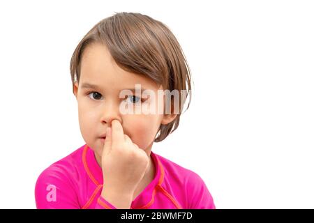 little school girl picking her nose, bad habits of children Stock Photo
