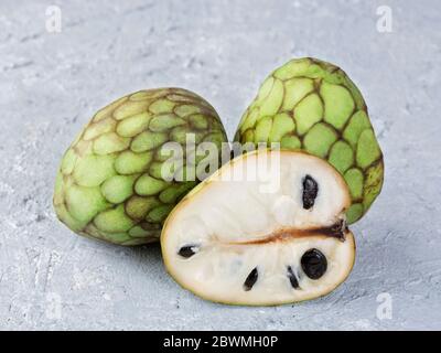 Cherimoya fruits on a grey background Stock Photo