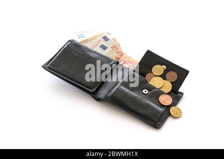 Open money purse with a few euro coins and notes, cash check, debt and poverty in the economic crisis affected by coronavirus, isolated on a white bac Stock Photo