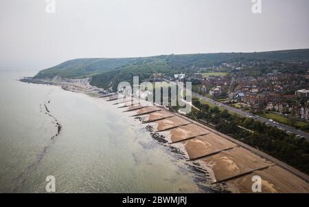 Eastbourne beach and the South Downs, England. An aerial view over the Meads area of Eastbourne edging into the white cliffs and rural South Downs. Stock Photo