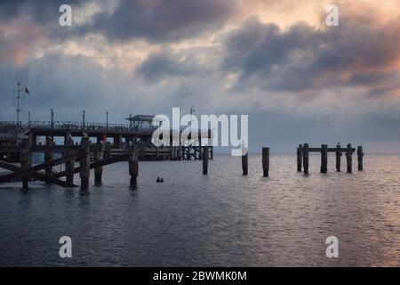 Morning view of a sea pier in the south of England on the shore of a sea bay. Swanage Bay, United Kingdom Stock Photo