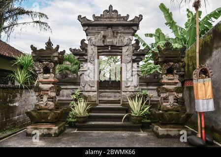 Ubud, Bali/Indonesia - March 24, 2019 : Traditional entrance gate in balinese house of Ubud village in Bali, Indonesia Stock Photo