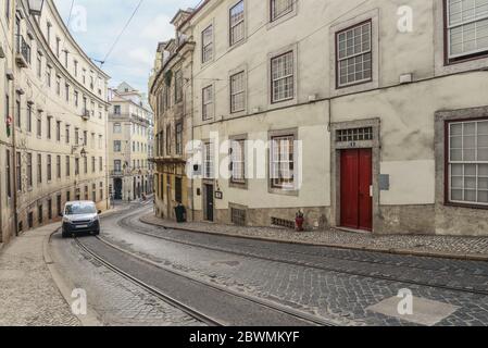 LISBON, PORTUGAL - JULY 4, 2019: Narrow cobblestone streets of the Chiado district in Lisbon, Portugal Stock Photo