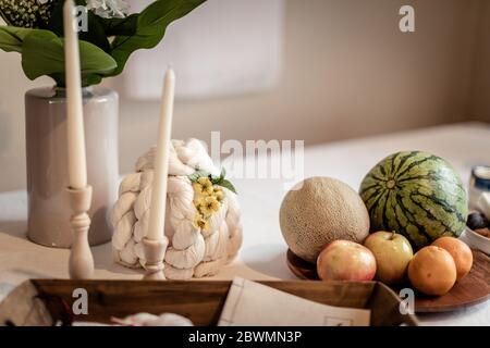 Korean traditional table for first birthday baby, Various fruits, threads, Flowers and candles Stock Photo