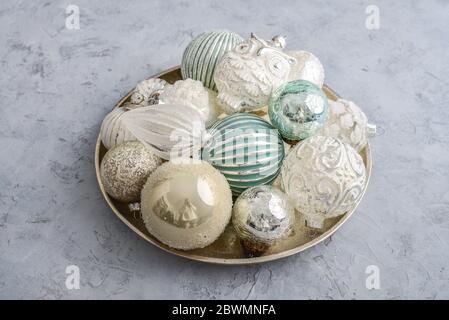 Christmas decorations on golden round tray on grey background Stock Photo
