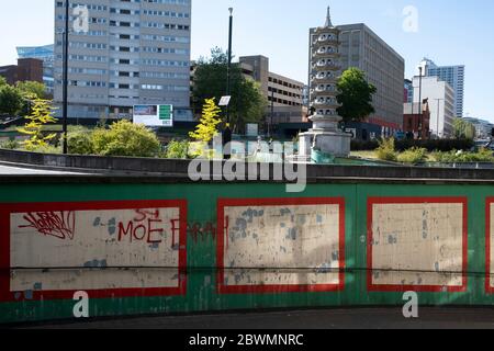 Holloway Circus, where new buildings juxtapose the old pagoda in the city centre of Birmingham virtually deserted under Coronavirus lockdown on 20th May 2020 in Birmingham, England, United Kingdom. This area is a maze of underpasses and pedestrian subways linking various main roads in the city centre. Coronavirus or Covid-19 is a new respiratory illness that has not previously been seen in humans. While much or Europe has been placed into lockdown, the UK government has put in place more stringent rules as part of their long term strategy, and in particular social distancing. Stock Photo