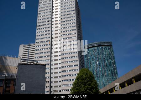 Rainbow flag being flown from the window of a tower block in the city centre during the Coronavirus lockdown on 20th May 2020 in Birmingham, England, United Kingdom. Coronavirus or Covid-19 is a new respiratory illness that has not previously been seen in humans. While much or Europe has been placed into lockdown, the UK government has put in place more stringent rules as part of their long term strategy, and in particular social distancing. Stock Photo