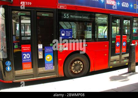 London, UK - 2  June 2020:  TFL buses with new signs restricting the number of passangers on to  the buses to maintain social distancing. Only 10 on single deck buses and 20 for a double deck bus. Some non-essential stores, car dealerships and outdoor markets in Britain on June 1 were able to reopen from their COVID-19 shutdown in an easing of coronavirus lockdown measures. Photo: David Mbiyu/ Alamy News Live Stock Photo