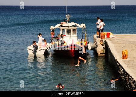 Greece, Karpathos island, people having refreshment time at the port of Diafani, August 16 2008. Stock Photo