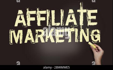 Affiliate Marketing - words written with chalk on blackboard. Business model concept Stock Photo
