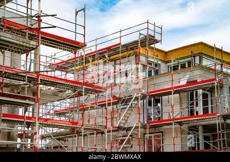 Shell construction of two apartment buildings with scaffolding Stock Photo