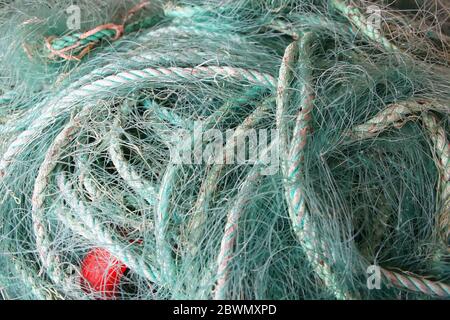 Close up of green blue turquiose rope and fishing nets used for fishing or sailing, Norway. Stock Photo