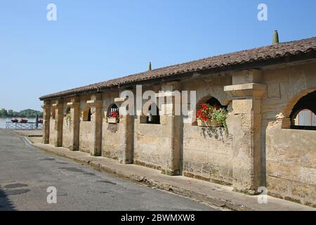 Public medieval bath house or wash house in the centre of Bourg, also Bourg-sur-Gironde, Gironde department in Nouvelle-Aquitaine, France. Stock Photo