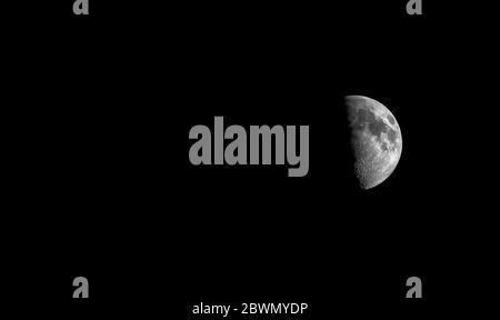 Waxing Gibbous Moon against black sky Stock Photo