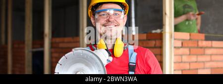 Man holding construction tool Stock Photo