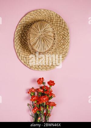 Spring vintage straw hat on pink background Stock Photo