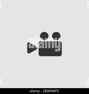 Cinema camera icon flat. Black pictogram on grey background. Vector illustration symbol Stock Vector