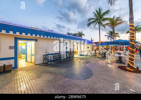 FORT MYERS, FLORIDA - FEBRUARY 2016: Tourists enjoy city promenade at night. Stock Photo