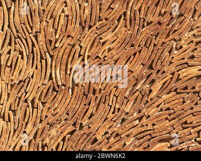 Wall panel made from a small pieces of coconut shell. Stock Photo