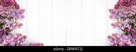 Lilac flowers on white wooden background. Stock Photo