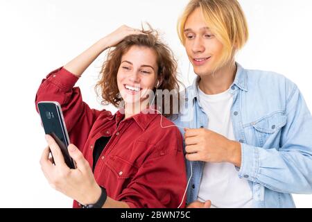couple in love do selfie together and rejoices isolated on white background Stock Photo