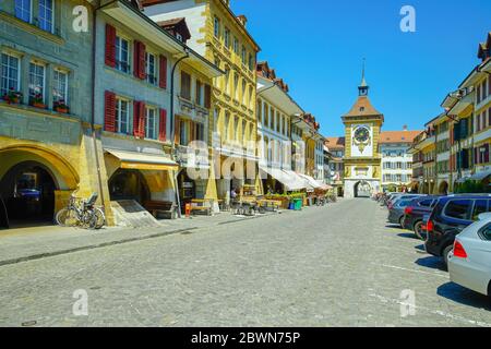 View of famous Bern Gate (Berntor) and Hauptgasse in Murten (Morat). Fribourg canton, Switzerland. Stock Photo