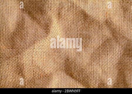 Brown Burlap Fabric with Rough and Thick Fibers Background. Stock Photo