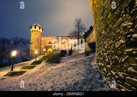 Buda Castle night view in winter featuring Mace tower Stock Photo