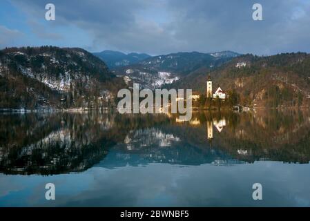 Mountains reflecting in Bled lake, springtime Stock Photo