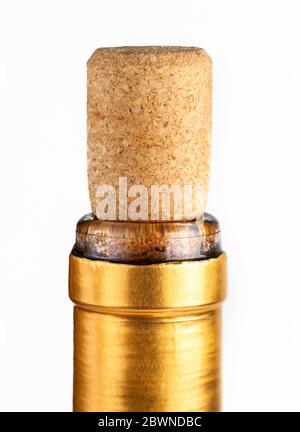 Gold premium wine bottle cork macro, closeup Cork sitting tight, closed golden bottle neck wrapping, side view, top part up close Stock Photo