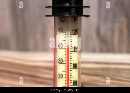 Thermometer displaying high 40 degree hot temperatures in summer day. Stock Photo