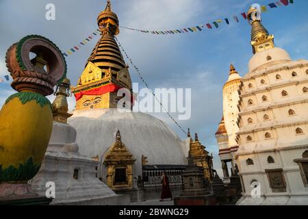 A Buddhist monk wearing a face mask as a preventive measure against Covid-19 is seen walking around a deserted Swayambhunath Stupa, UNESCO world heritage site during the 71st day of the nationwide lockdown.Nepal has confirmed 2099 Coronavirus (COVID-19) positive cases, 266 recovered and 8 death. Stock Photo