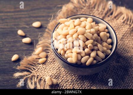 Cedar pine nuts in a wooden spoon Stock Photo