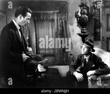 JOHN RIDGELY as Eddie Mars and HUMPHREY BOGART as Phillip Marlowe in ...