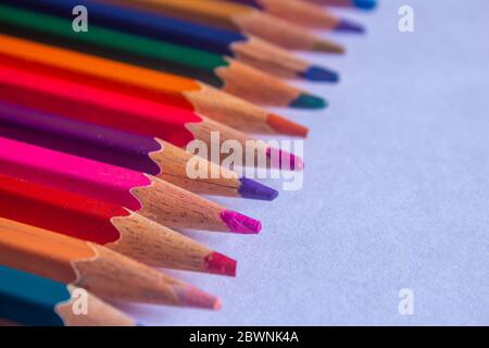 Color pencils arranged in a creative way. Student art supplies. Stock Photo