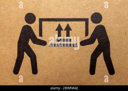 Packaging symbol to indicate heaviness and needs two people to lift Stock Photo