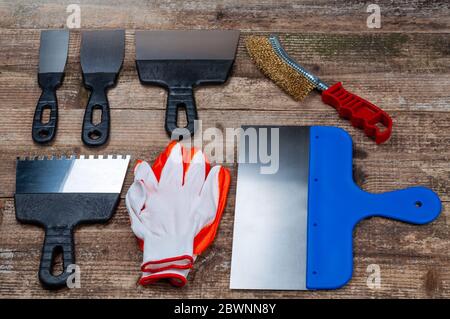 Plastering and painting tool on wooden background. Stock Photo