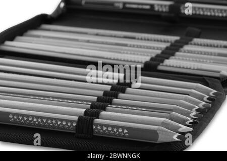 School pencil case with different colored pencils in black and white Stock Photo