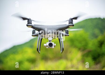 Dark drone in flight. Stock Photo