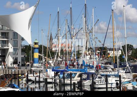 A symbolic sail and the masts and rigging of yachts in port of Eckernförde Stock Photo