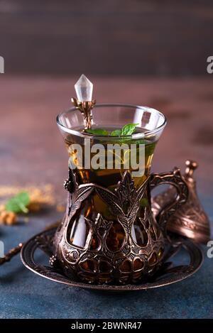 Turkish tea with mint in a traditional cups on the stone background Stock Photo