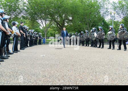 Washington, United States Of America. 01st June, 2020. Washington, United States of America. 01 June, 2020. U.S. President Donald Trump walks across Lafayette Square to St Johns Episcopal Church through a phalanx of riot police June 1, 2020 in Washington, DC Trump had the area cleared by police using tear gas on peaceful protesters for the photo op. Credit: Shealah Craighead/White House Photo/Alamy Live News Stock Photo