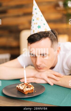 Young man celebrating birthday alone at home Stock Photo - Alamy