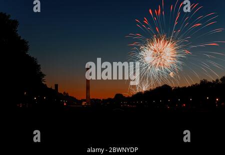 American Celebration Washington Monument at night with holiday festive 4th July fireworks on Independence Day