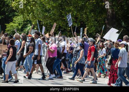 05-30-2020 Tulsa USA People marching together down street with signs in BLM rally- black and white young and old together Stock Photo