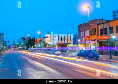 Historic buildings at night on 4th Avenue at F Street in downtown Anchorage, Alaska, AK, USA. Stock Photo