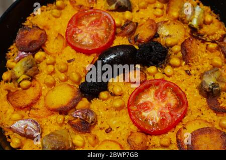 Close-up of a cooked baked rice casserole, typical dish from Valencia, Spain. Stock Photo