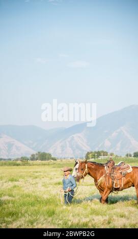 Cowboys and cowgirls on horses Stock Photo