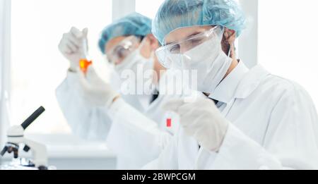 close up. group of laboratory technicians conduct testing in the laboratory . Stock Photo