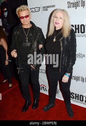 April 5, 2017, Los Angeles, California, USA: Billy Idol and Penelope Spheeris arrive for the Premiere Of 'SHOT! The Psycho-Spiritual Mantra of Rock' held at Pacific Theatres  in Los Angeles, California at The Grove on April 5, 2017. (Credit Image: © Billy Bennight/ZUMA Wire) Stock Photo